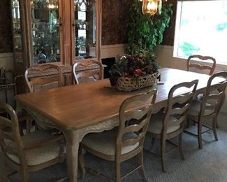 Dining room table, 8 chairs, with pads and 2 leafs