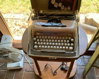 small side table, typewriter in case