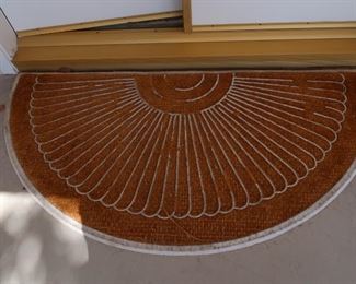 Two sunshine doormats