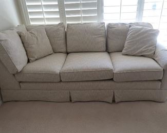 This is an "L" shaped couch with one piece in the living room and the other in the office