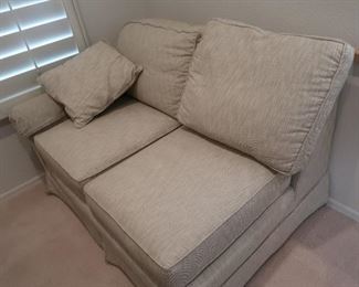 "L" shaped couch. One piece in the office, one-piece in the living room