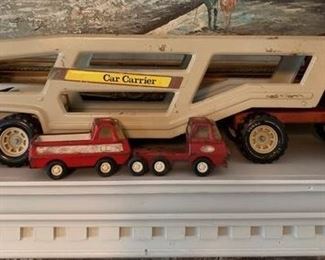 Vintage Rare Metal Tonka Car Carrier with (2) Small Tonka Trucks - Carrier Measures 26 inches long.