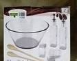 *It appears the Salad set is in the original box with original packaging.* 

As per box-  

9.5" Salad Bowl  4.75" in height
Salt and Pepper Shakers 
Two Oil and Vinegar Bottles 
Wood Server Fork and Spoon 