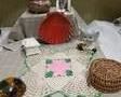 Crocheted Vintage Doily, White, Pink, Green
 This beautiful doily has large scalloped edges, and is 11" in diameter.
This doily is off white with pink middle and green trim.
Amber paperweight, Cute angel mouse figurine, catch all plastic shell, white trinket box, Rutan basket with 5 coasters, small picture frame, ceramic trinket pot with lid.