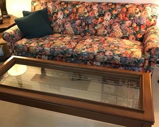 Custom upholstered sofa and unique coffee table made from a door.