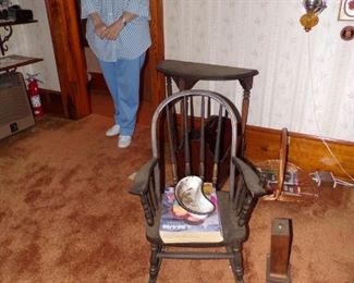 Childs rocking chair 1930s $45.00, Half Moon 1930s table $25.00, Charming lady in doorway Not For Sale