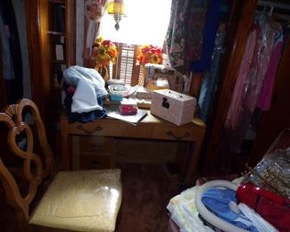 Serious sewing machine and work table $100.00, the chair goes with the dining table