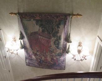 huge hanging tapestry over stairway