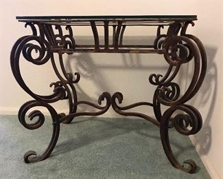 Wrought Iron end tables with glass tops. (2 matching tables)