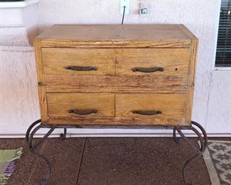 4 drawer wooden cabinet on wrought iron legs