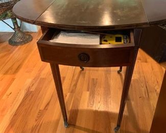 #14		Oval  Drop-side Table w/drawer on Wheels  29x17.5-35x28.5	 $75.00 
