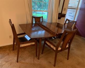 #1		Mid-Century Table w/3 leaves & 4 chairs   5'-8'x42x29	 $175.00 
