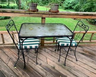 #36 Black Table w/glass 36x24.5x29 w/2 chairs w/green/white stripe cushions $75.00