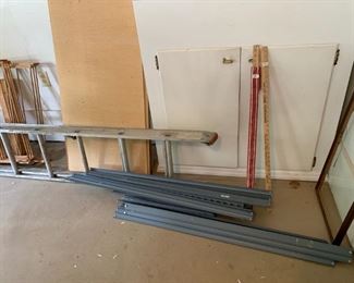 #95 4 foot metal shelf with 3 particle board shelves $50.00