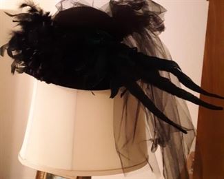 Black feather and veil hat