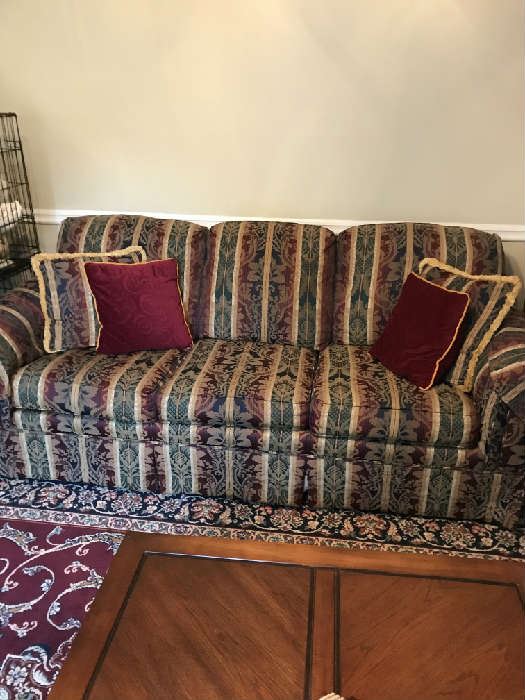 Nice clean upholstered sofa; and there is a matching love seat