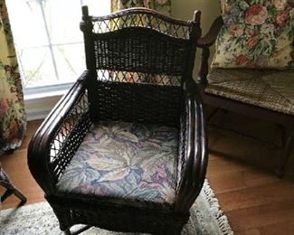One of the wicker chairs that go with a dining table.