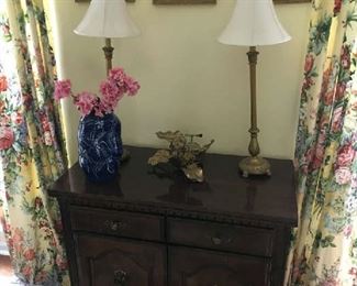 A nice cabinet in dining area to hold linens, towels, etc.