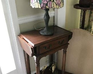 As you enter the home a nice little drop leaf table with lamp