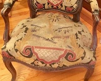 Antique upholstered wood arm chair