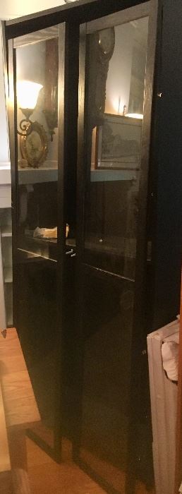 Black, glass front cabinet