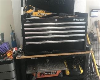 Tools, saws, pressure washer, shopvac, tile saw, dump cart, generator, ladders, edger, husky tool boxes and cabinets.