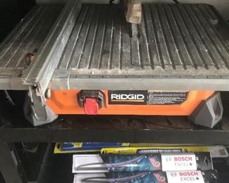 Tools, saws, pressure washer, shopvac, tile saw, dump cart, generator, ladders, edger, husky tool boxes and cabinets.