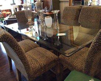 Pedestal dining table with (6) velvet leopard -print chairs