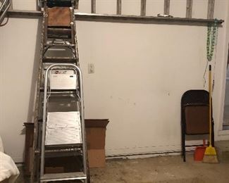 various sized aluminum ladders 