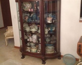 beautiful large antique curio with carved faces top
