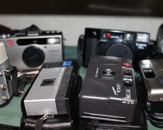INDOOR, WING 2, First room on Right, Leica in front row $135 mini el mar/Leica in back row mini lux zoom $395/Canon AF35ML $48