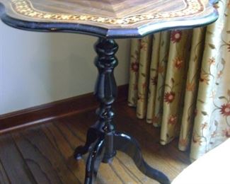 Inlaid wooded end table measures 25 inches tall by 21 wide.