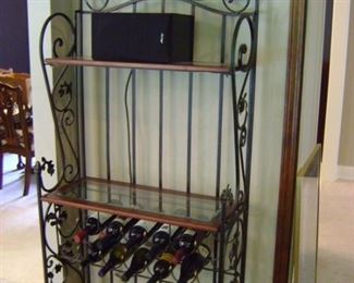 Wine rack with glass shelves is 76 inches tall by 32 inches wide and 13 deep.