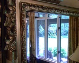 Ornate framed mirror is 46 by 34.