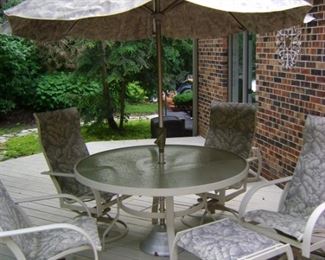 Outdoor patio chairs, table and umbrella.