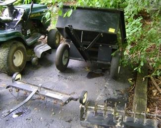 Mower includes de-thatcher, lawn aerator and trailer.