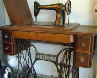 Early 1900's foot pedal Singer Sewing machine.  Perfect condition.