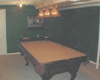 The pool table is partially unassembled for easier removal.  This is a picture of the fully assembled table with camel colored felt.