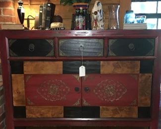 Red multi colored TV Cabinet 