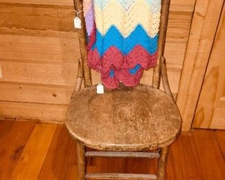 Wooden chair with beautiful multi colored Afghan