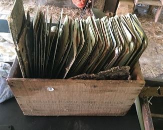 Box full of miscellaneous license plates 