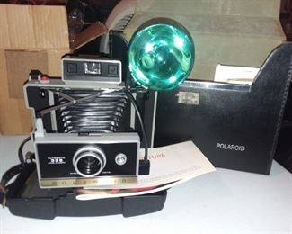 Vintage Polaroid camera with flash