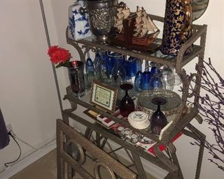  Small little Bakers rack matches dining room set, which also  matches the coffee table set and the barstools 
Only $100 