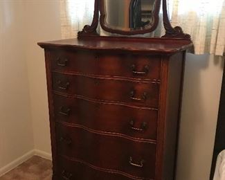 Antique chest of drawers with beveled mirror