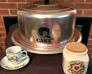 Vintage cake holder and a "Avon 1978" porcelain cup & saucer with 22K gold trim.