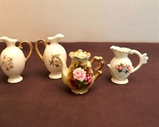 "Enesco" mini teapot with salt & pepper urns, and a mini handled pitcher.