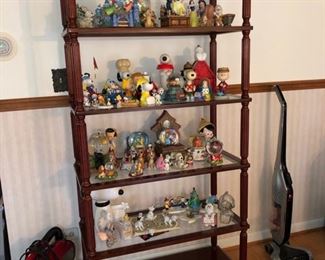 Large wood shelving unit with glass shelves