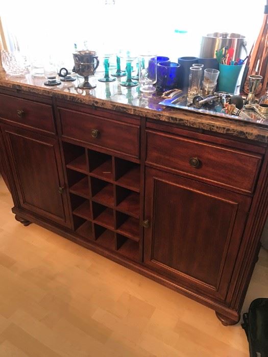 Marble top bar cabinet with wine bottle storage