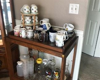 Serving cart, assorted coffee mugs and serving pitchers, etc