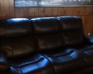Media room couch - both sides lay back and ottomans pop out to kick your feet up!